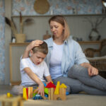 autistic child playing blocks