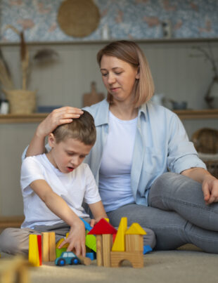 autistic child playing blocks